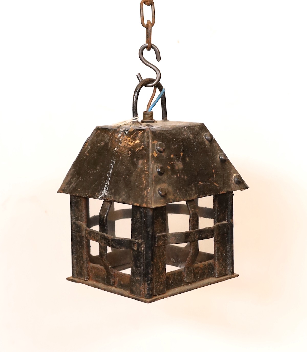 An early 20th century English wrought iron lantern with later clear glass panels, height 24cm. width 15cm